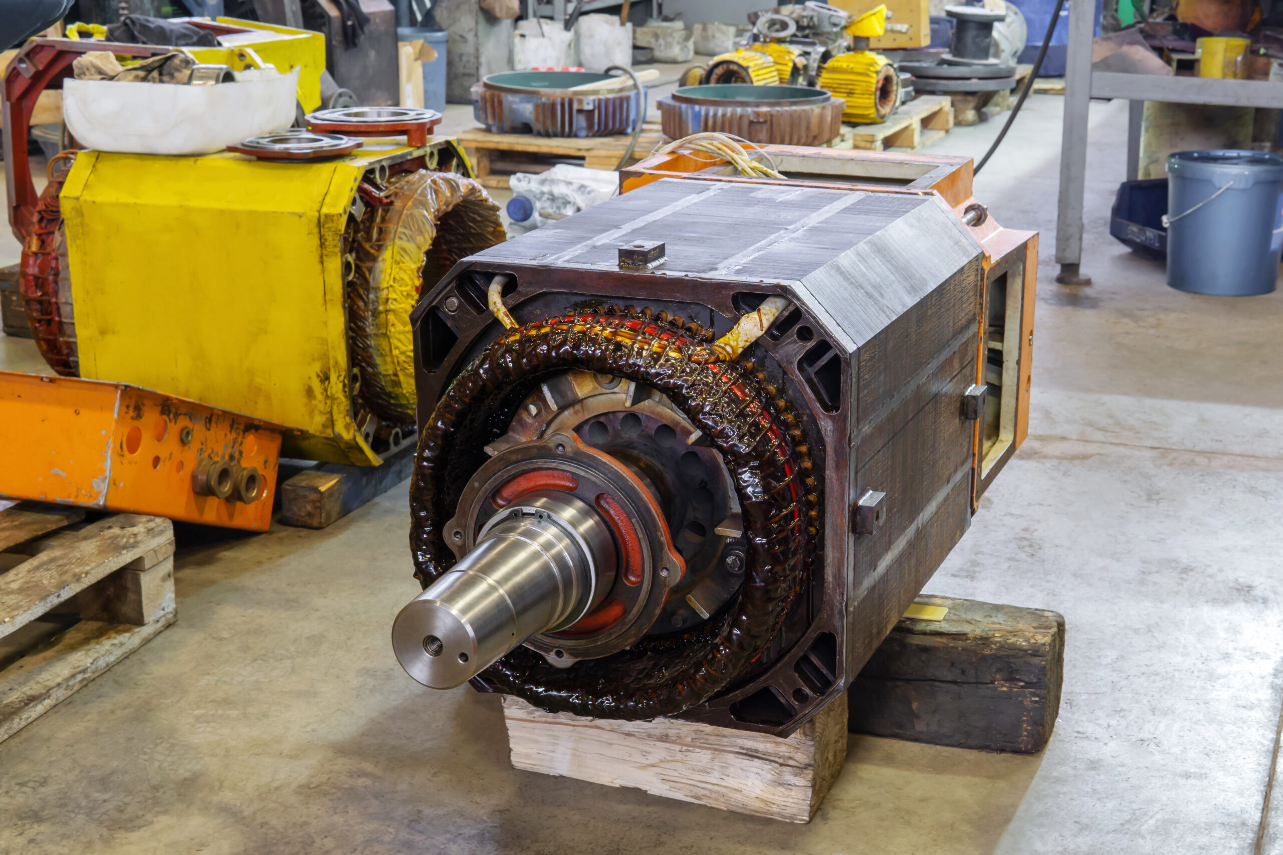 disassembled large electric motor in a repair shop