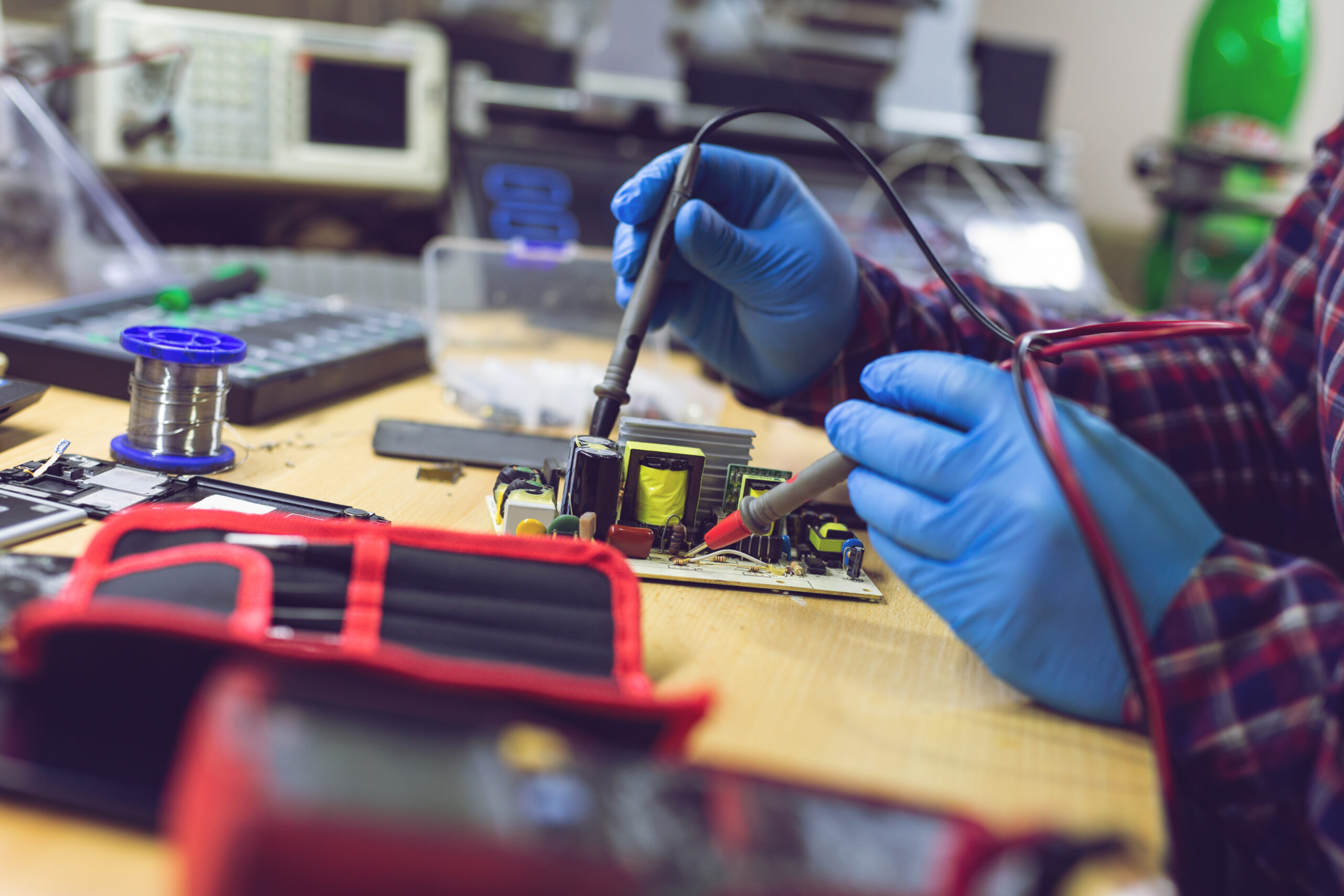 engineer or technician repair electronic circuit board